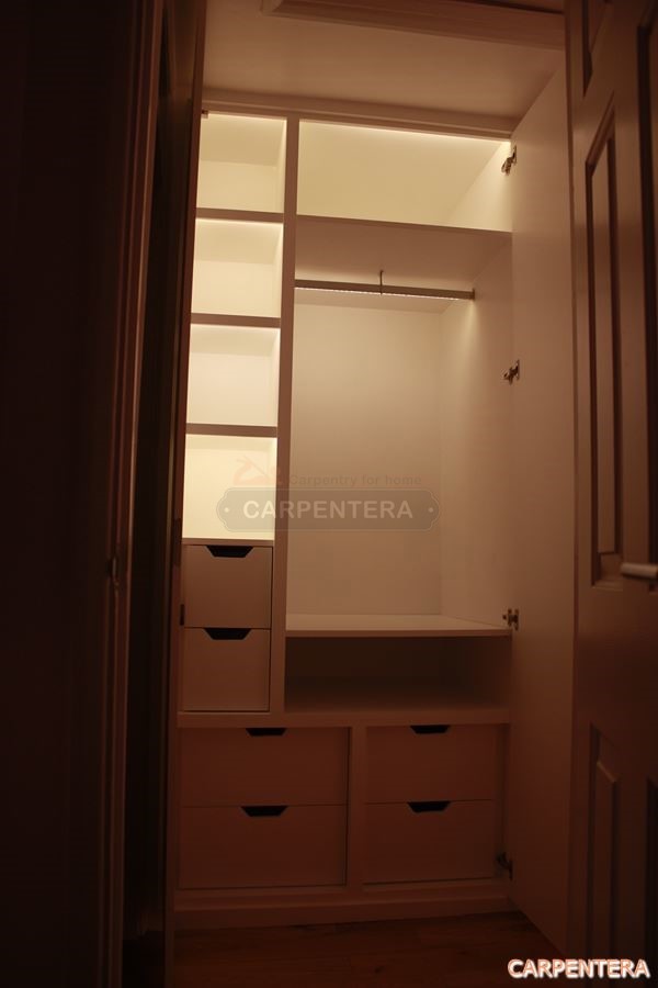 wardrobe with lights on loft - london